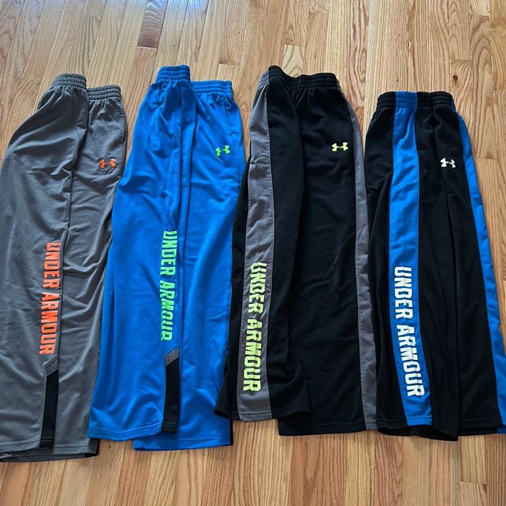 4 pairs of Under Armour athletic pants